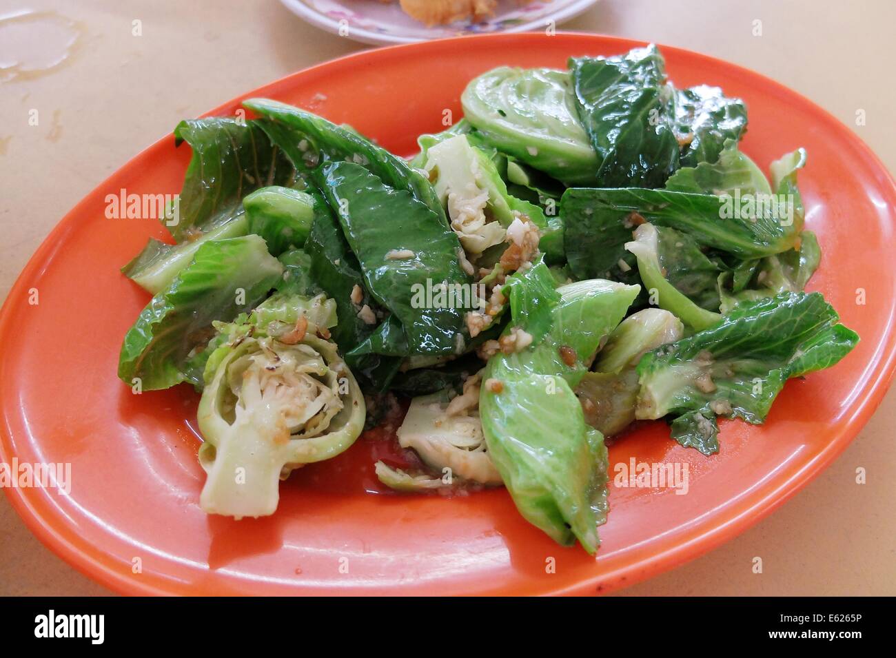 Stir Fried Brussel Sprout Leaves with Garlic Stock Photo Alamy