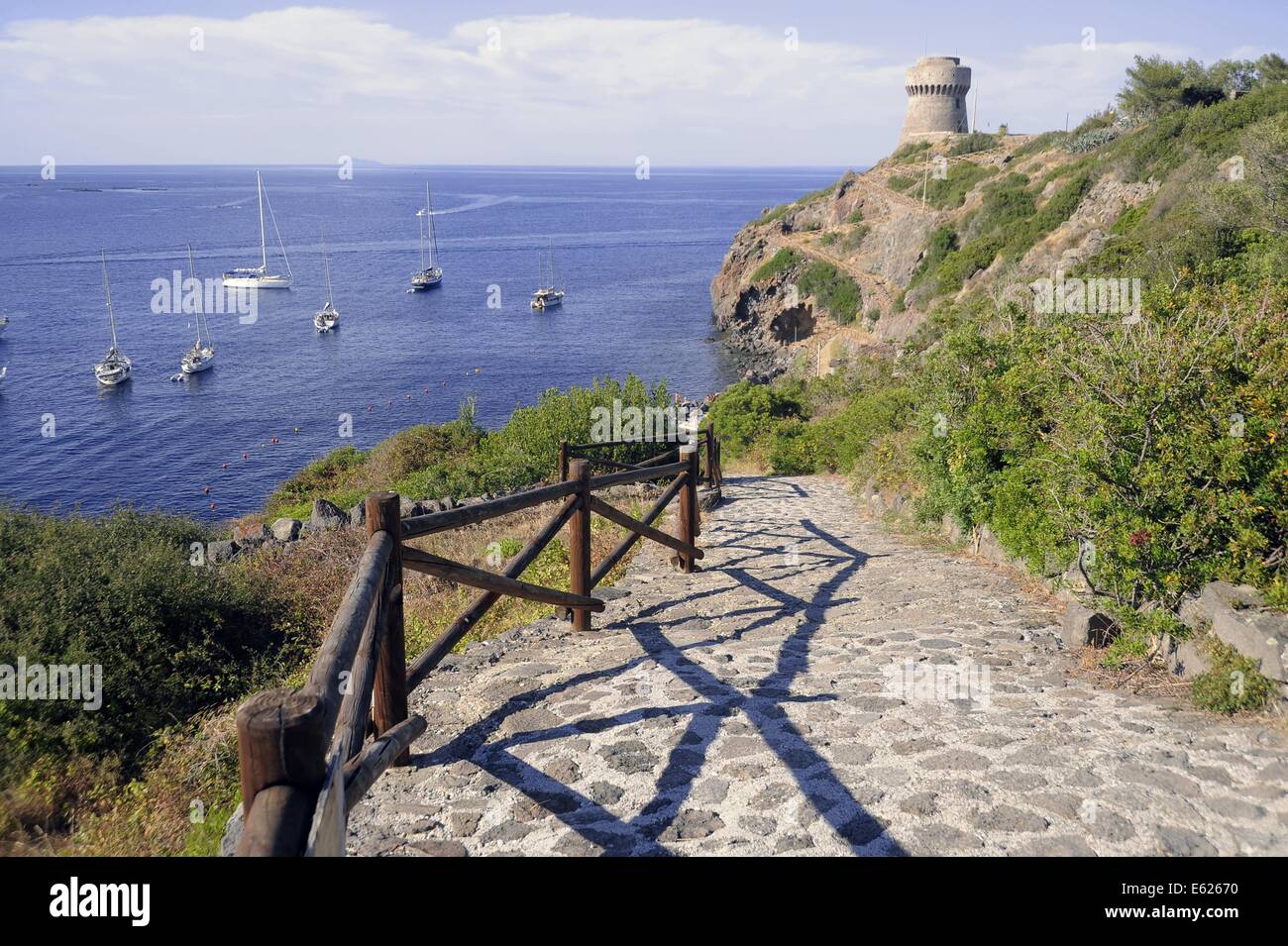 Capraia island (Tuscan Archipelago, Italy), yachts moored in the bay under the Genoese tower Stock Photo