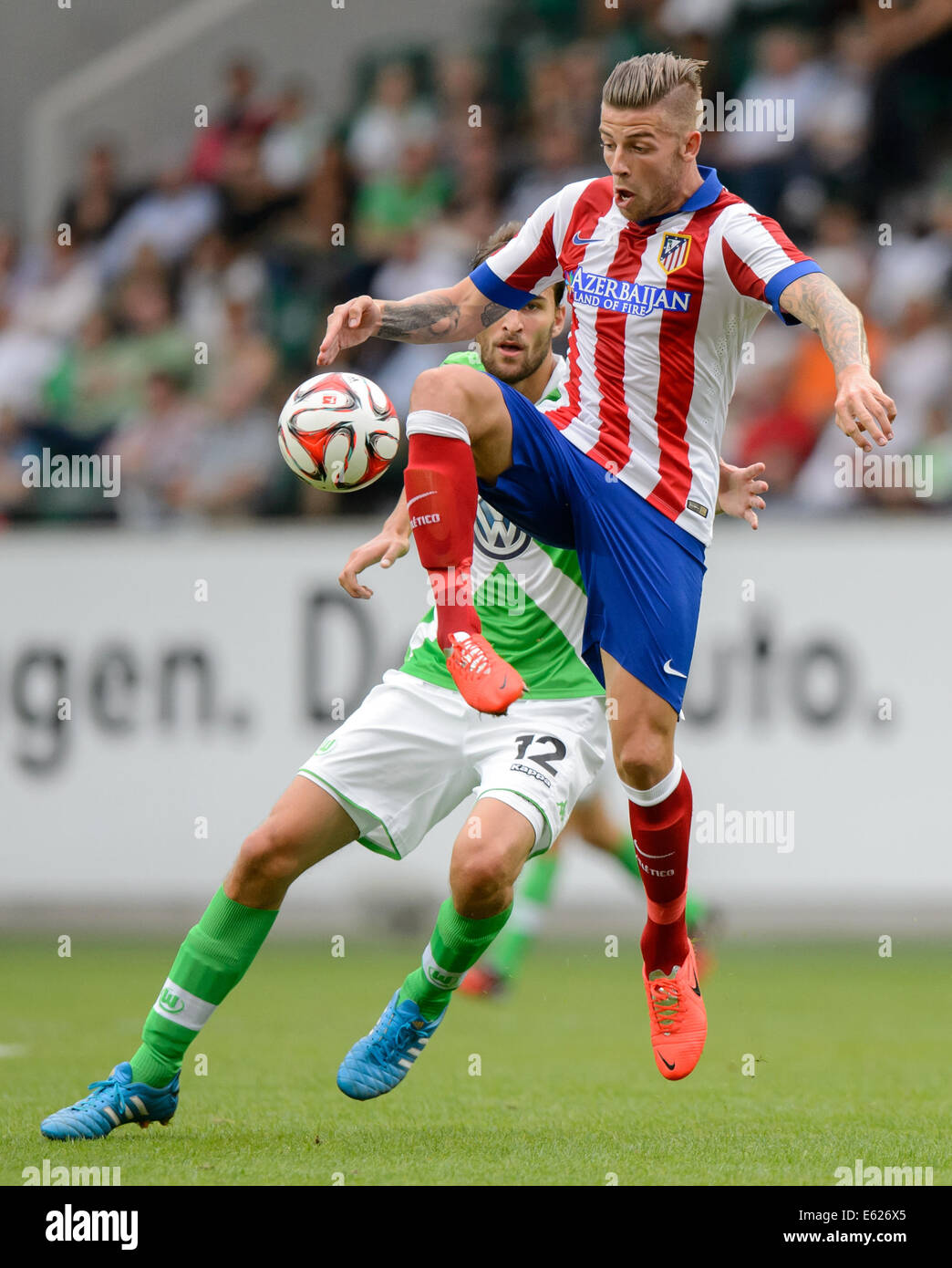 Wolfsburg, Germany. 10th Aug, 2014. Madrid's Toby Alderweireld in action during the soccer test match between VfL Wolfsburg and Atletico Madrid at Volkswagen Arena in Wolfsburg, Germany, 10 August 2014. Photo: Thomas Eisenhuth/dpa/Alamy Live News Stock Photo