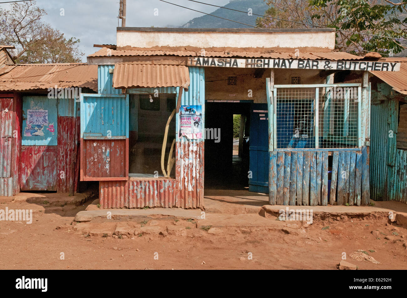 Third world corrugated iron shack or roadside shop or duka butchery on Namanga Nairobi road near Namanga Kenya East Africa  SHOP Stock Photo