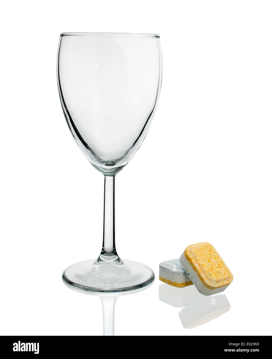 Dishwasher tablets with glass wine glasses on white background isolate
