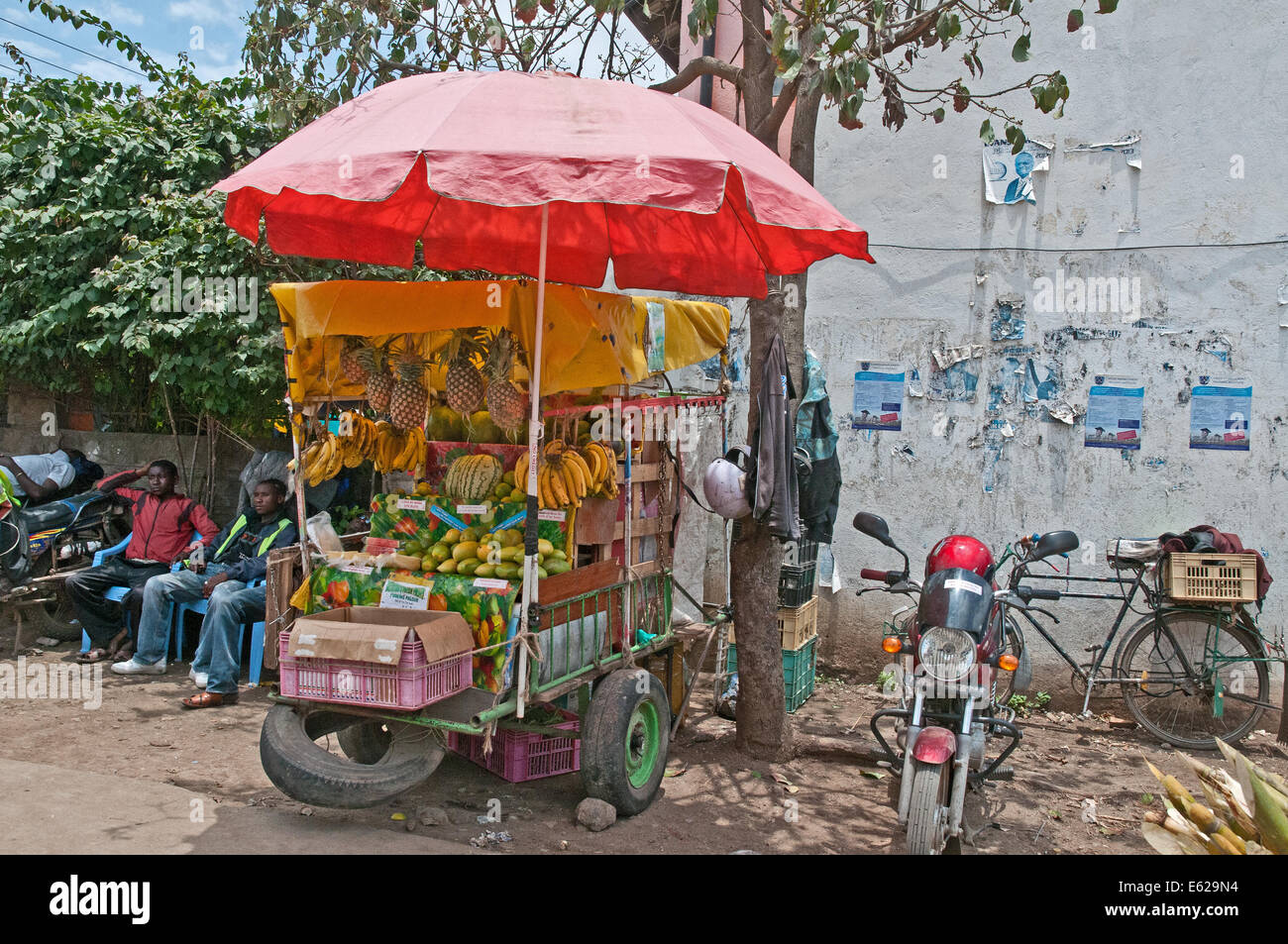 Roadside fruit and vegetable stall with umbrella shade in Nairobi South C district Kenya Africa Stock Photo