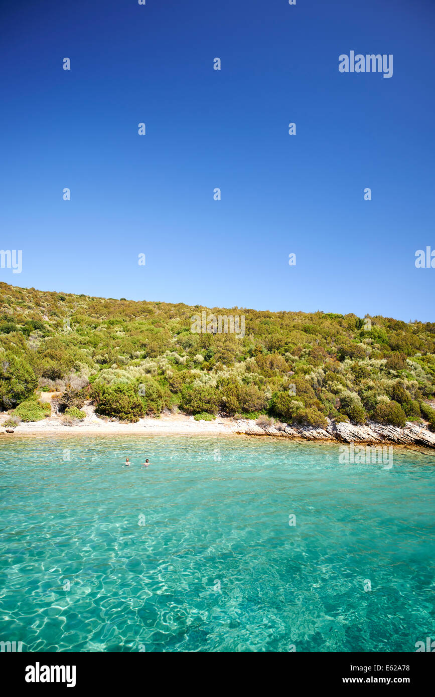 Mother & daughter swimming in clear turquoise water Stock Photo