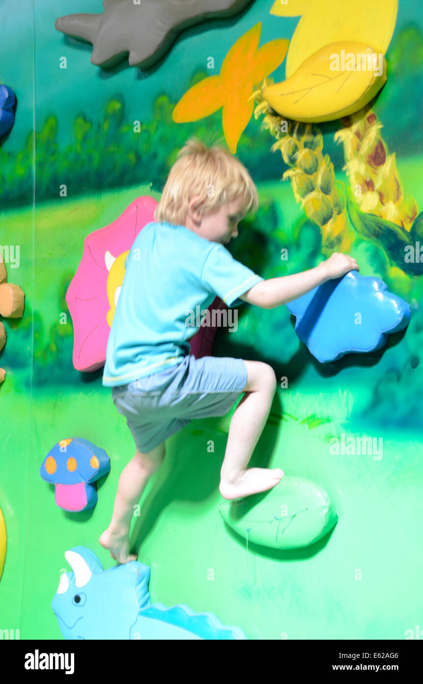 young boy climbing indoor play centre Stock Photo Alamy