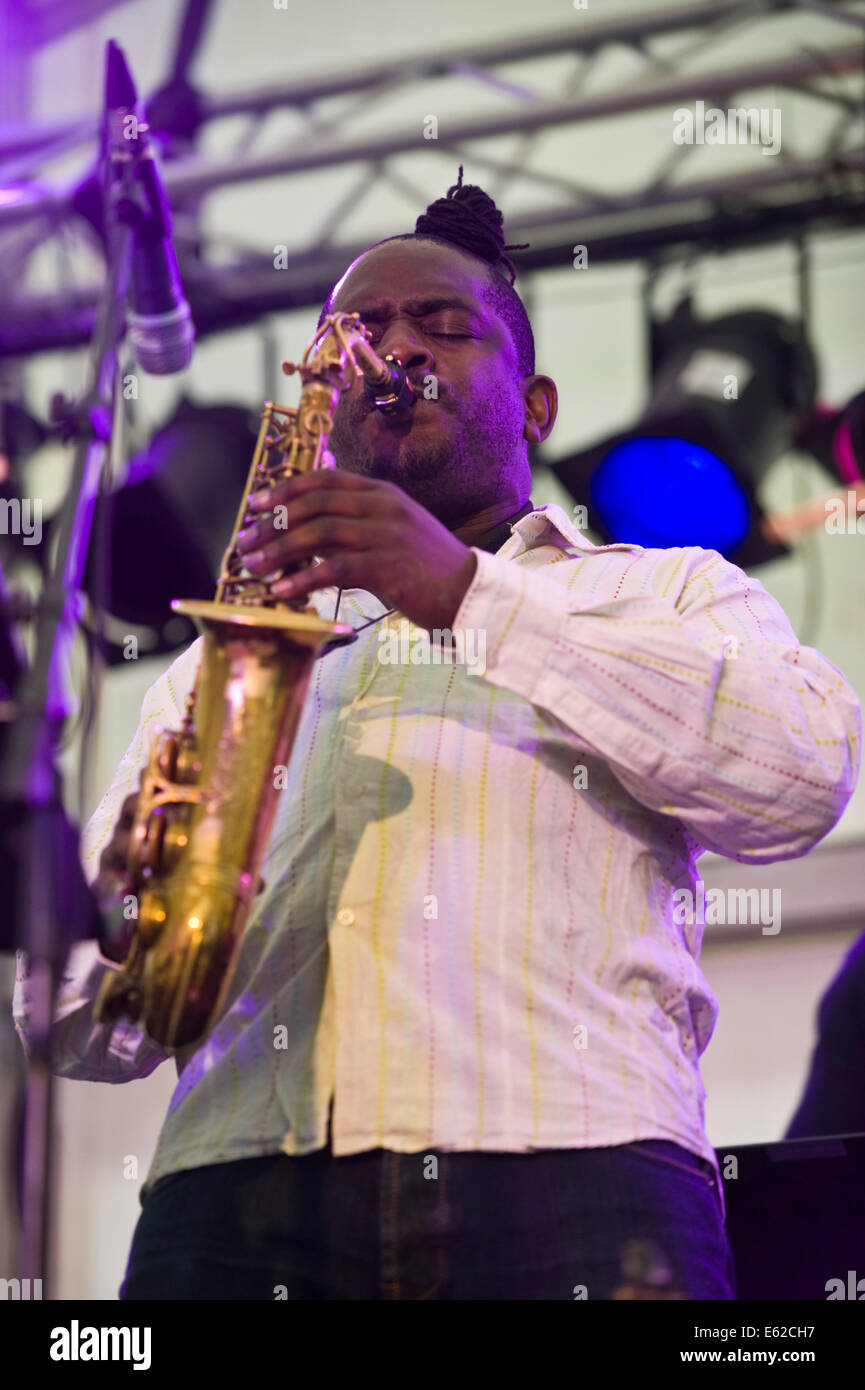 Sax player with Township Comets jazz band from South Africa performing on stage at Brecon Jazz