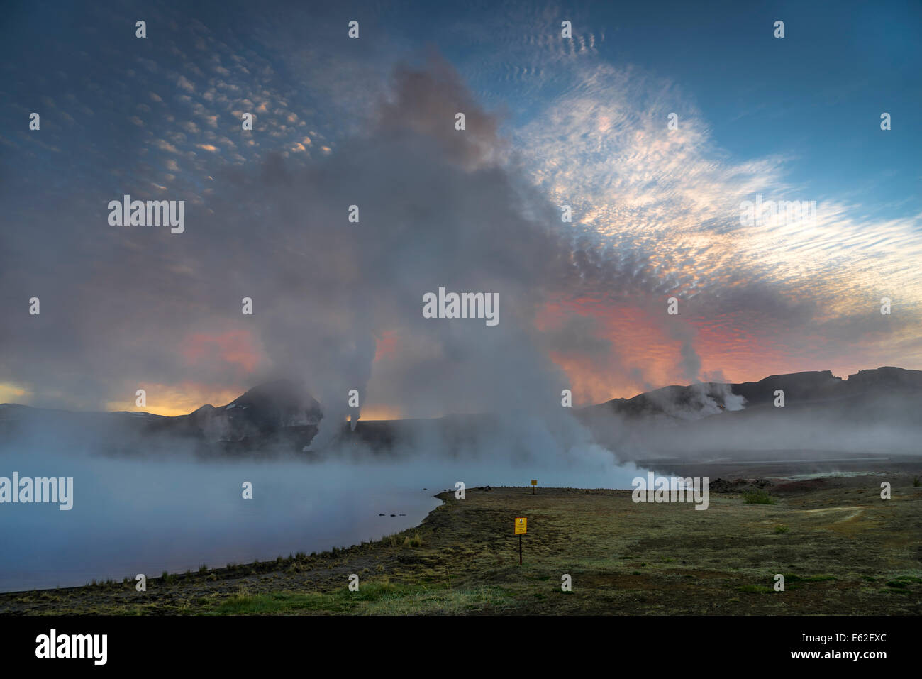 Steam and foggy landscape by The Bjarnarflag Geothermal Power Plant,  Lake Myvatn area, Northern Iceland   Steam and foggy lands Stock Photo