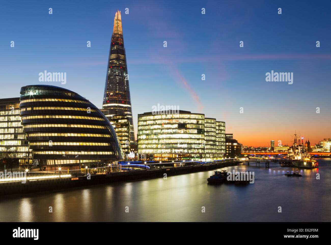 The Shard, City Hall and buildings on Southbank of River Thames at dusk, London, England Stock Photo