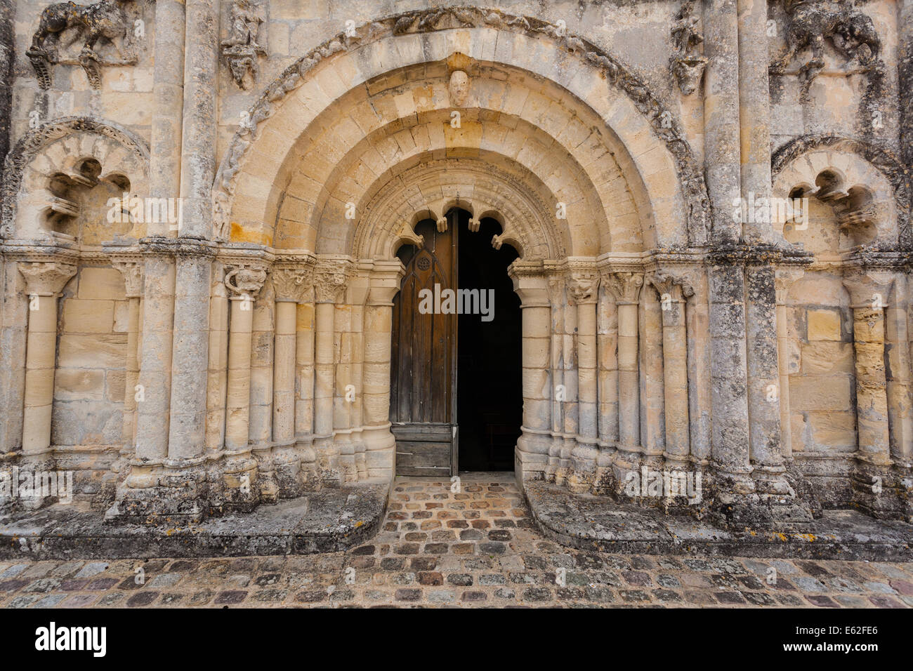 Full view of the main door of Petit Palais et Cornemps romanesque church, Gironde France Stock Photo