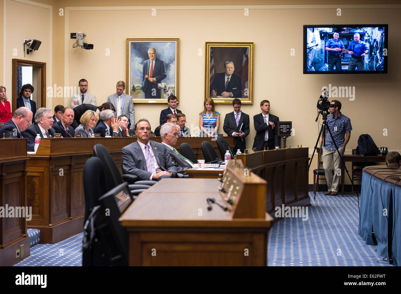 Representative Steve Stockman (R-TX) asks astronauts Steve Swanson and Reid Wisemen a question at the live downlink with the International Space Station (ISS) Thursday, July 24, 2014 at the Rayburn House Office Building in Washington, DC. The event provid Stock Photo