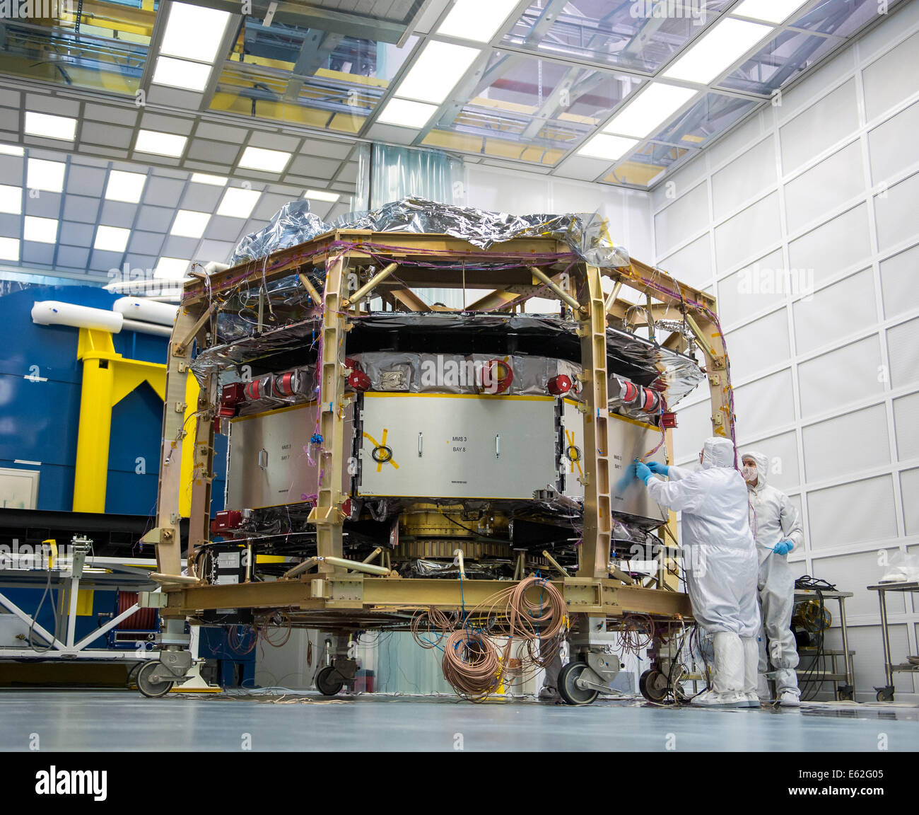 Engineers work on one of four Magnetospheric Multiscale (MMS) spacecraft in a cleanroom at the Naval Research Lab, Monday, Augus Stock Photo
