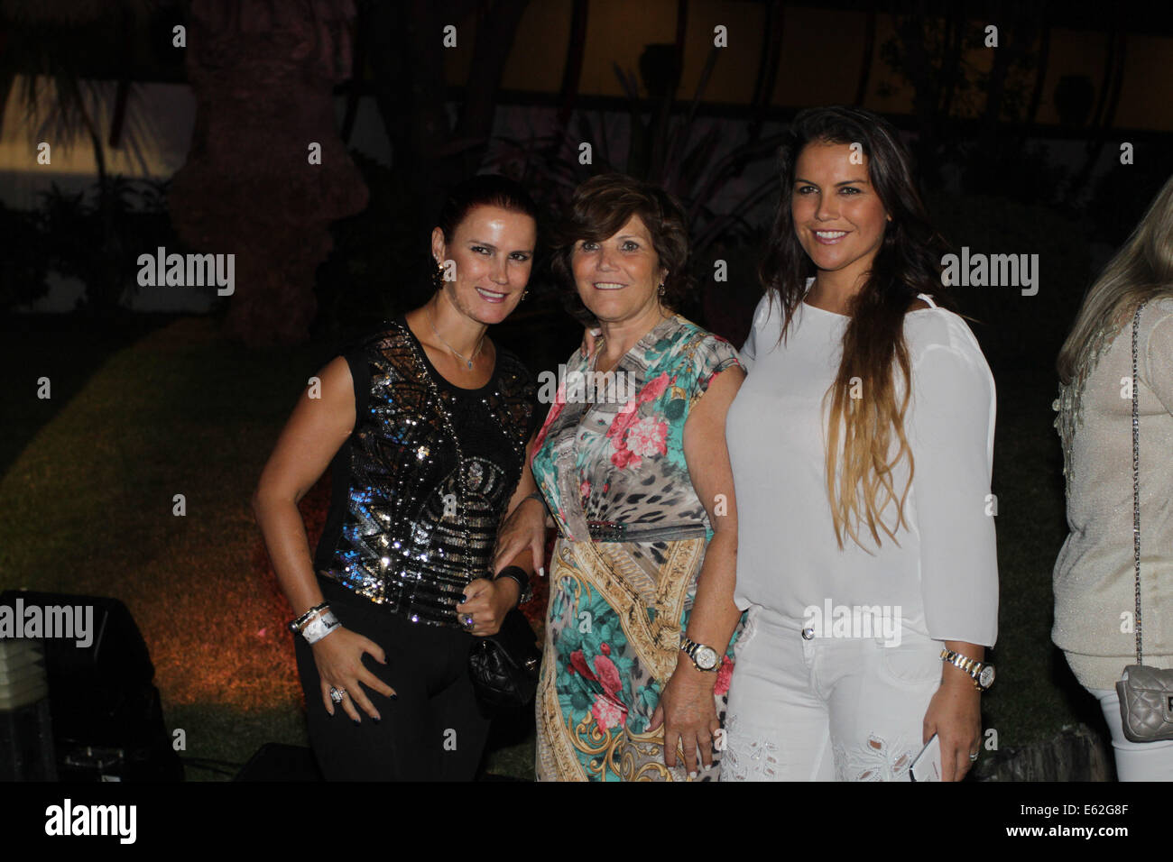 Algarve, Portugal. 11th Aug, 2014. Cristiano Ronaldo's mother, Dolores Aveiro (center) and sisters Elma (left) and Katia (right) waiting for Paris Hilton, as she'll play as DJ at Disco Seven in Vilamoura, Algarve, Portugal, 11.08.2014 Credit:  images4/Alamy Live News Stock Photo