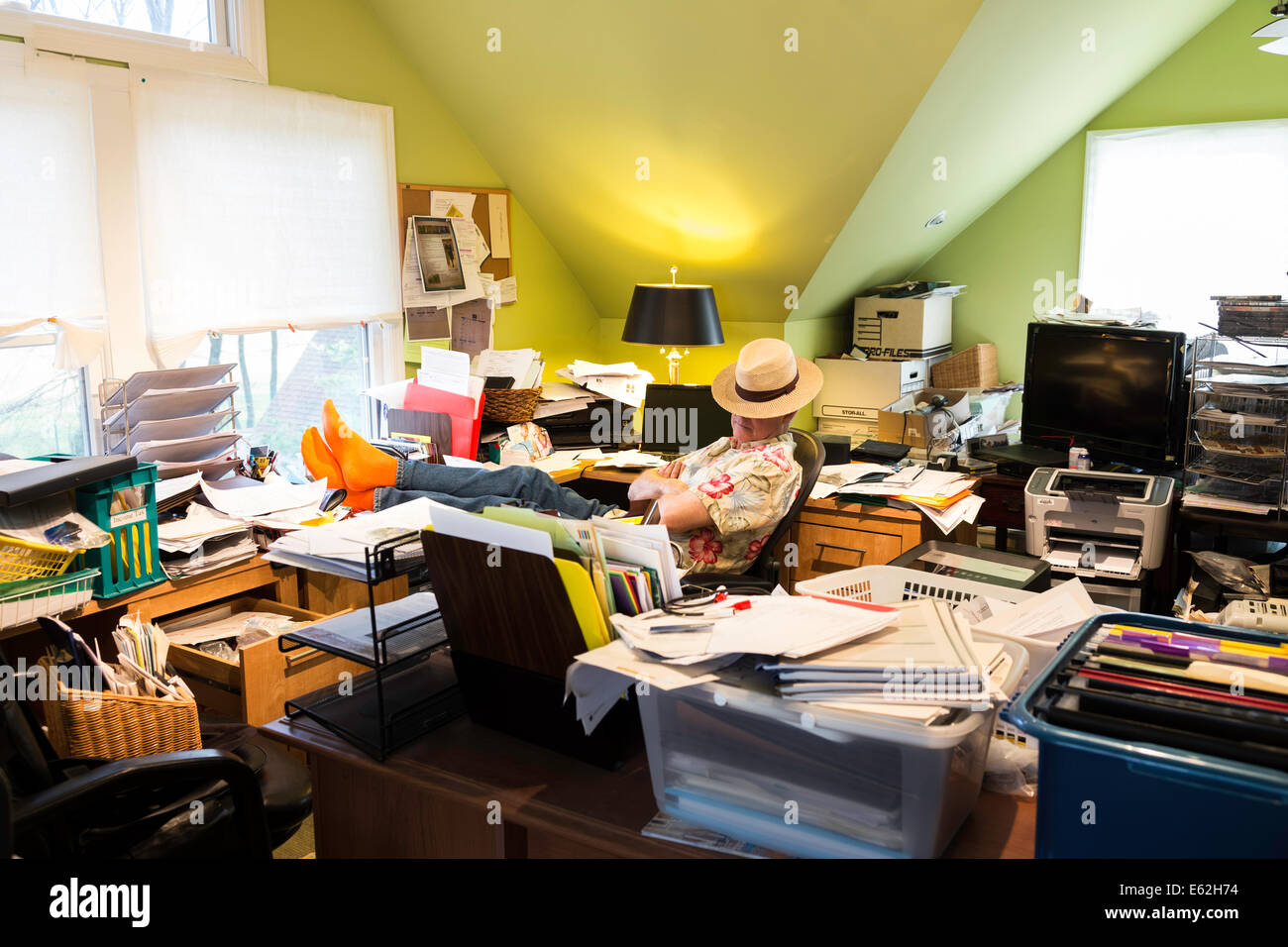 Businessman in Hoarders' Messy Home Office, USA Stock Photo Alamy