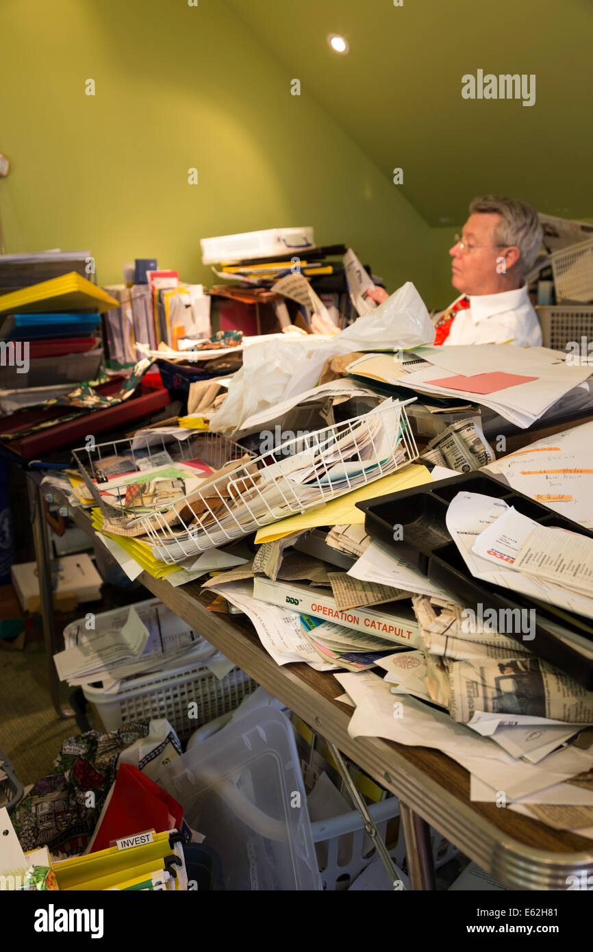 Businessman in Hoarders' Messy Home Office, USA Stock Photo Alamy