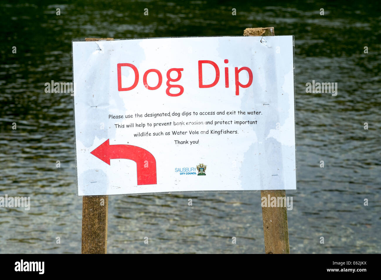 Dog dip sign indicating point at which dogs can enter a river at a site of special scientific
