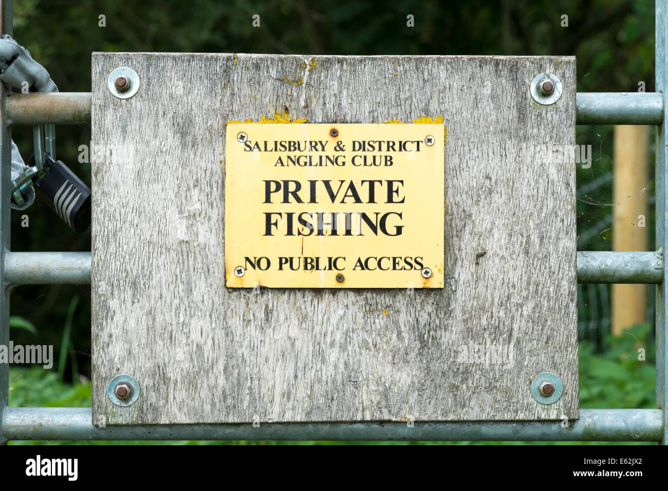 Small private fishing sign on a locked metal gate Stock Photo