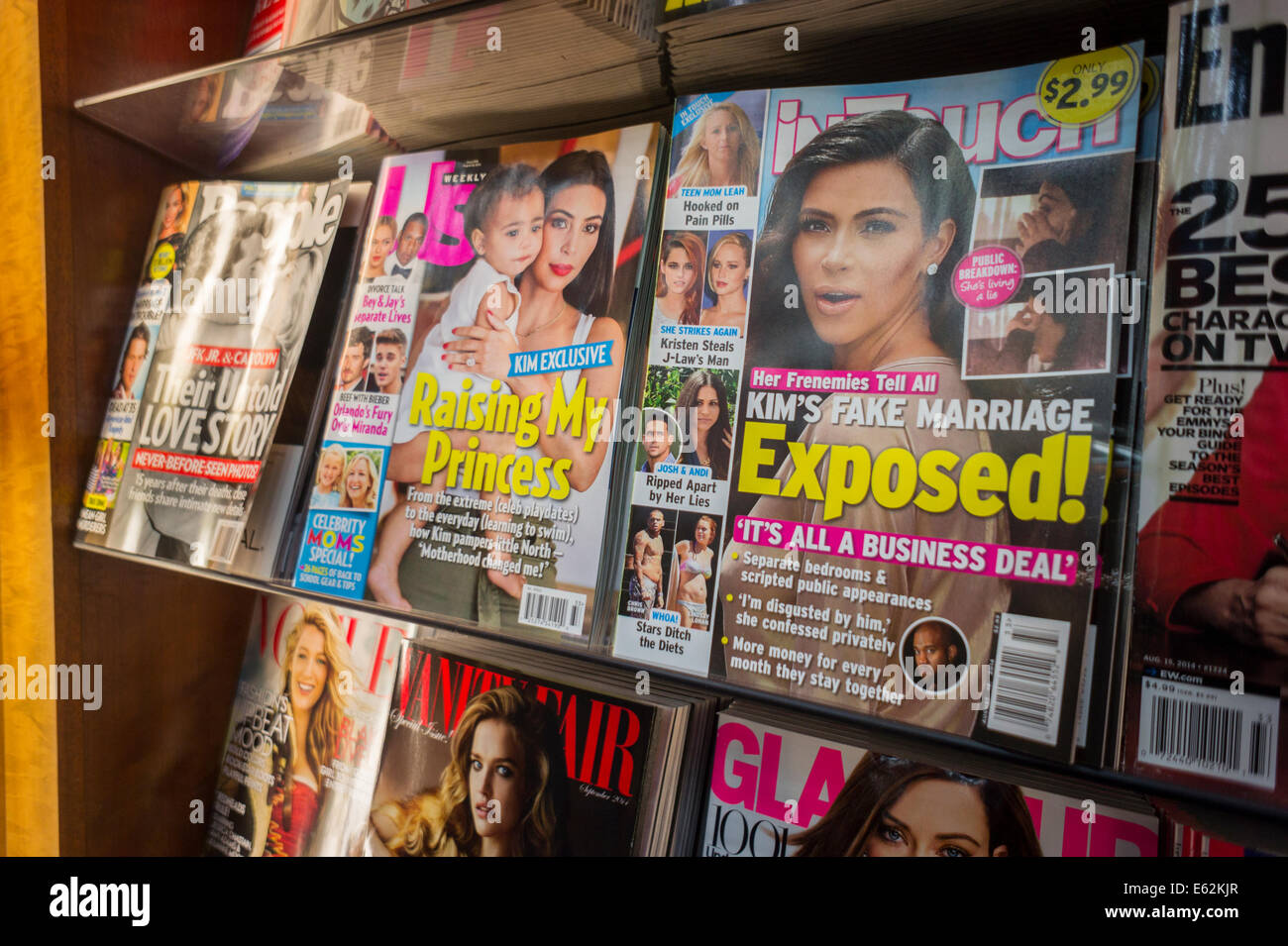 Celebrity tabloid magazines displayed in a newsstand in New York Stock Photo