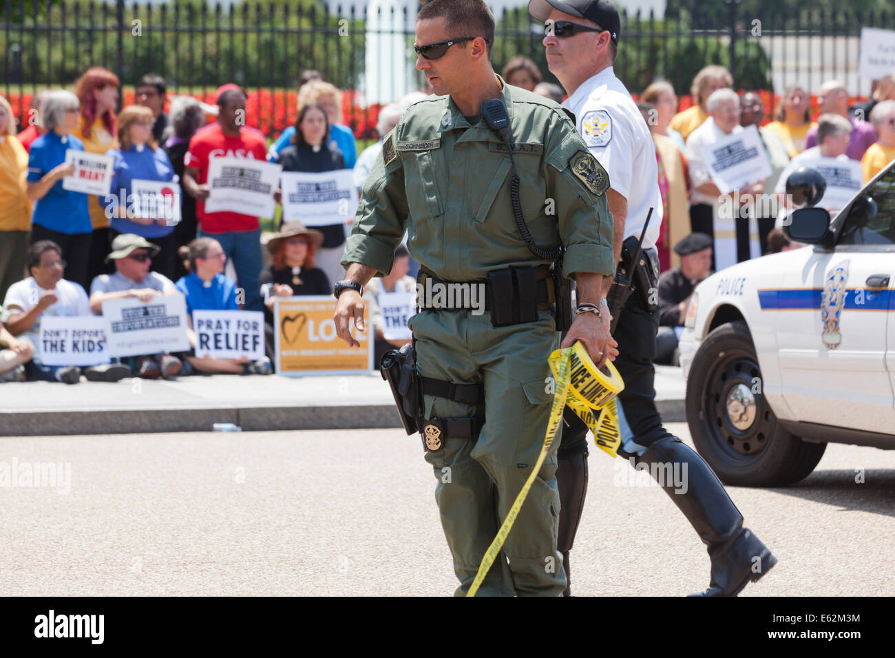 US Park Police SWAT policeman with police line tape during protest at the White House - Washington, DC USA Stock Photo