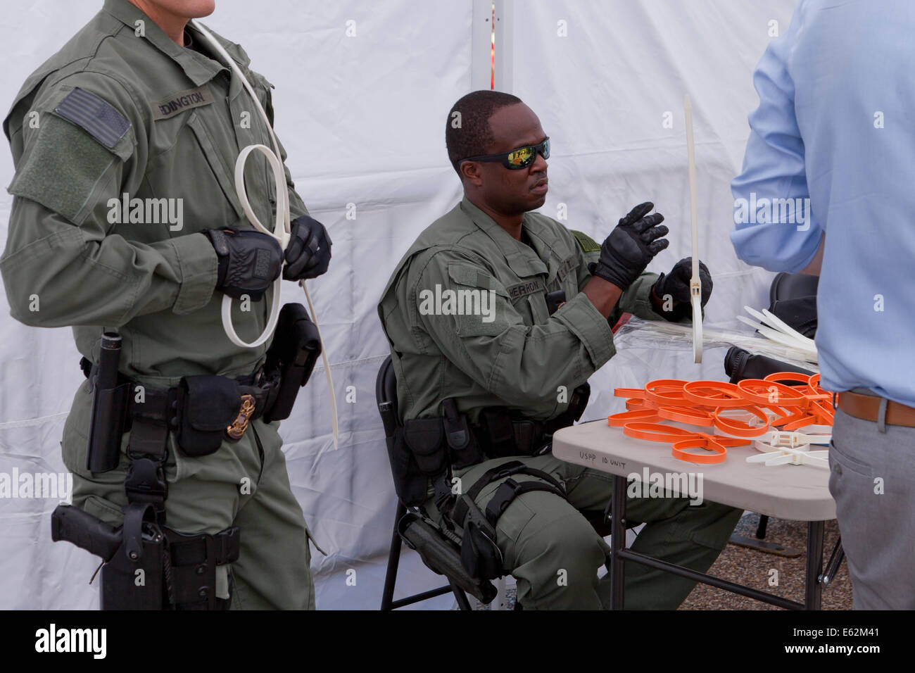 Police preparing plastic handcuffs during political protest - Washington, DC USA Stock Photo