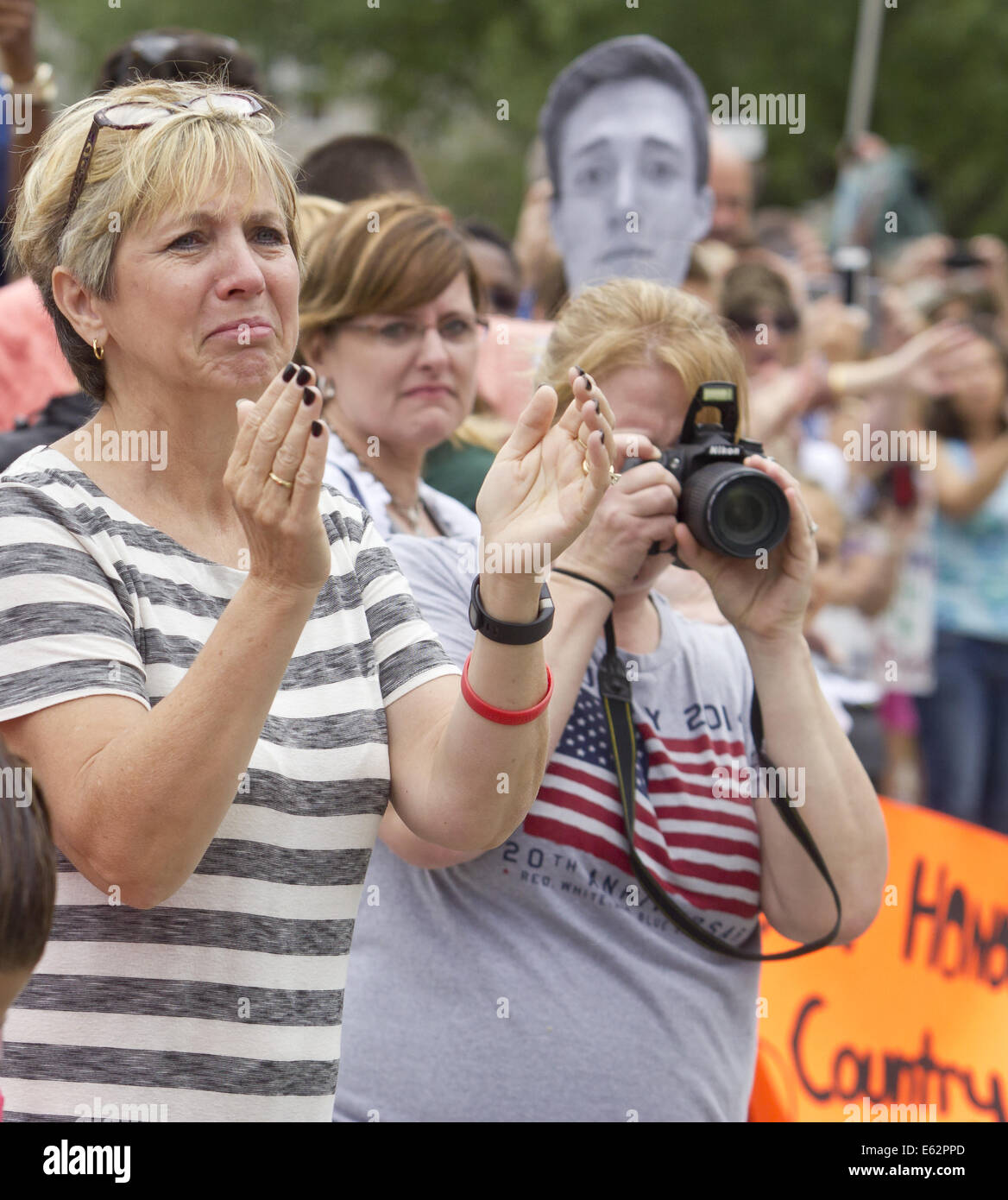 West Point, New York, USA. 12th Aug, 2014. Family and friends including Sheila Ryan, at left, of Kansas City, MO., welcome new cadets back to the United States Military Academy at West Point, New York, after the new cadets marched 12 miles from Beast Barracks at Camp Buckner. Mrs. Ryan was looking for her son Will Ryan, a member of the Class of 2018. Credit:  Tom Bushey/ZUMA Wire/Alamy Live News Stock Photo