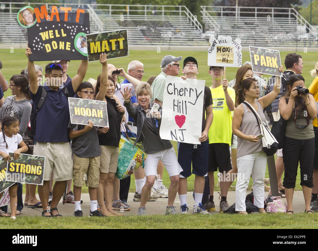 West Point, New York, USA. 12th Aug, 2014. Family and friends try to catch the attention of their new cadets at the United States Military Academy at West Point, New York, after the new cadets marched back from Beast Barracks at Camp Buckner. The 12-mile march back to West Point marked the end of Cadet Basic Training for the Class of 2018. Credit:  Tom Bushey/ZUMA Wire/Alamy Live News Stock Photo