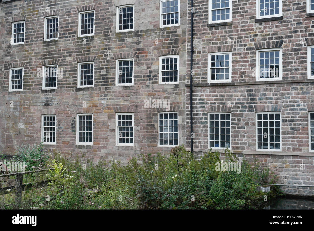 Old Mill buildings at Cromford Mill in Derbyshire England UK Grade I listed building former cotton mill Derwent valley world heritage site Stock Photo