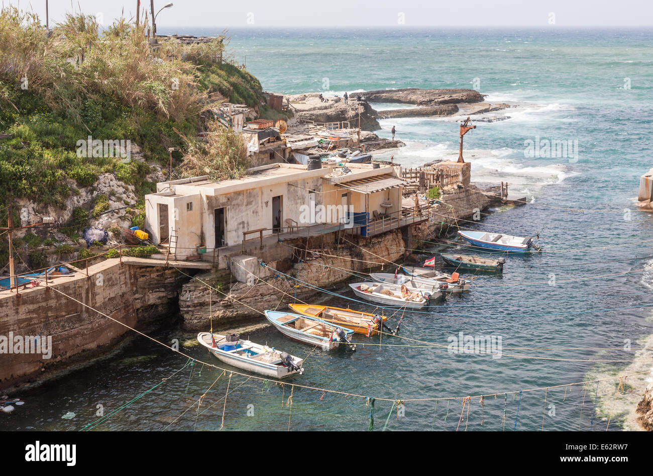 A small fishing village community and harbour on the Mediterranean coast, with moored boats