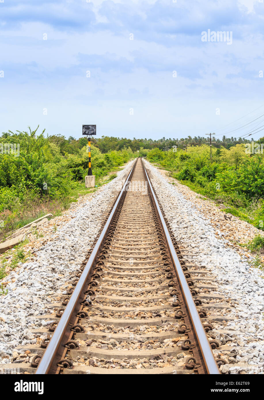 Long and straight railroad track Stock Photo