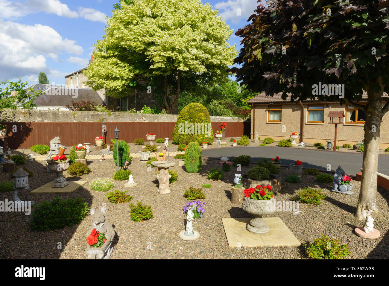 Kelso, Scottish Borders front garden with gravel, planters, shrubs