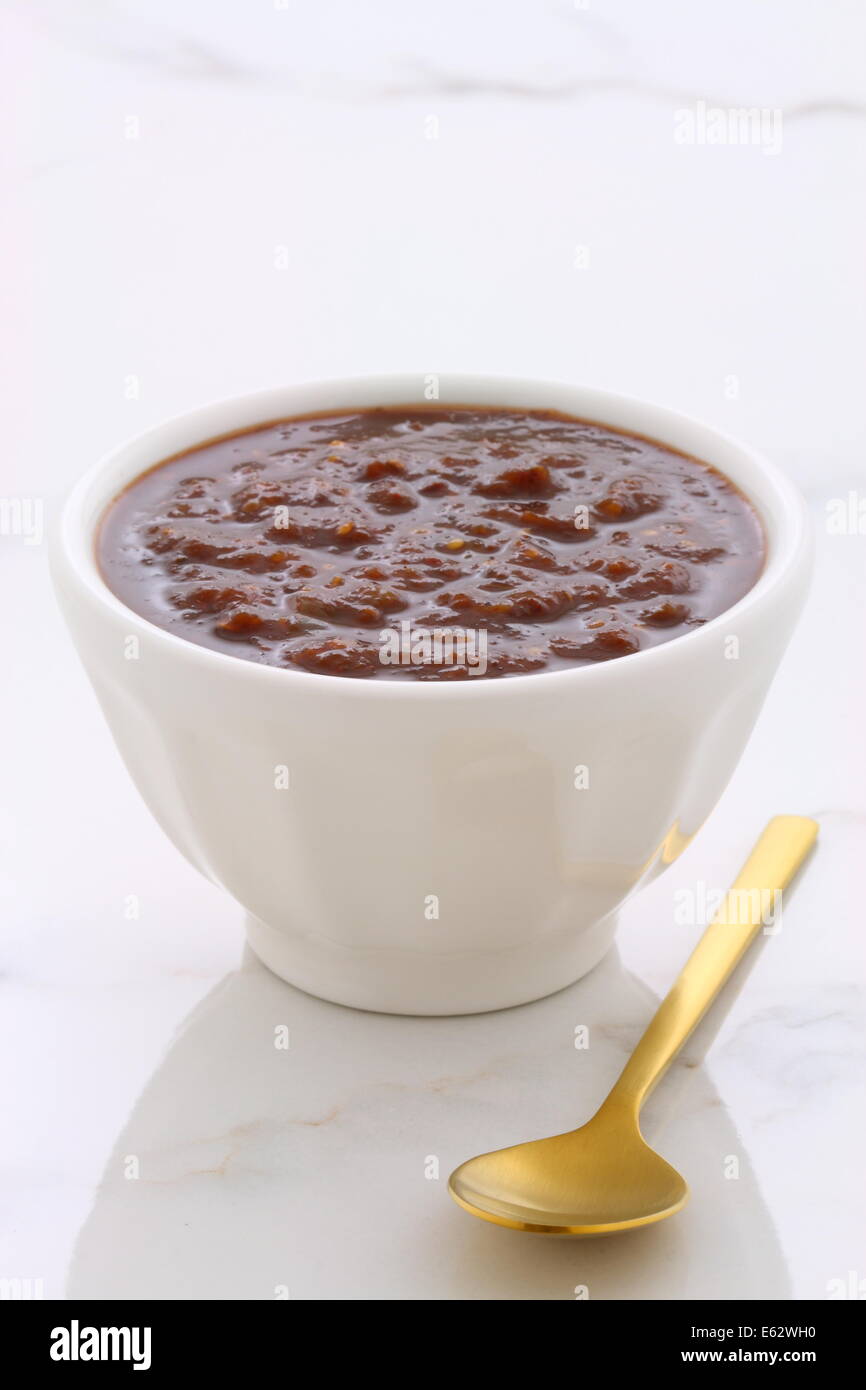 Artisan mexican chipotle sauce on vintage carrara marble table, with a delicious smoky flavor perfect for all your Mexican, tex- Stock Photo