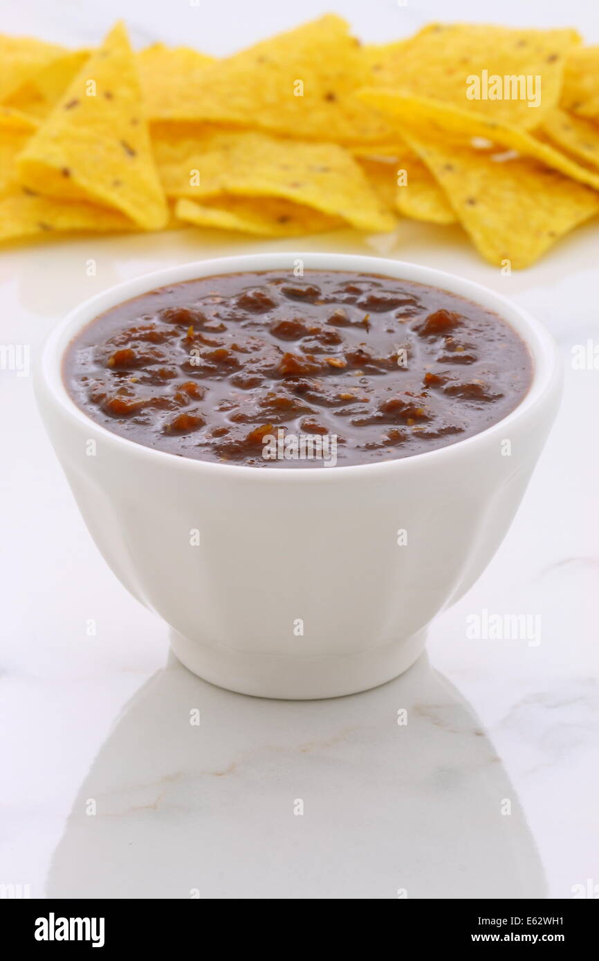 Artisan mexican chipotle sauce on vintage carrara marble table, with a delicious smoky flavor perfect for all your Mexican, tex- Stock Photo