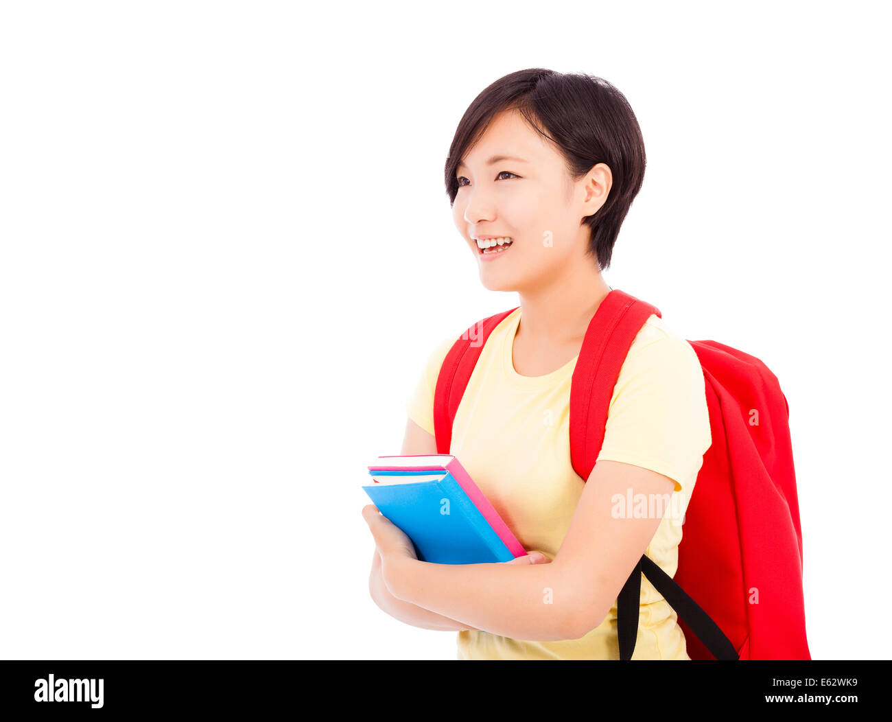Young female student holding book with white background Stock Photo - Alamy