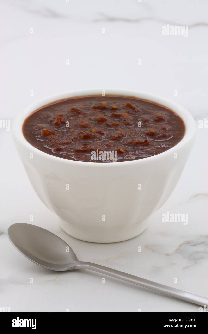 Artisan mexican chipotle sauce on vintage carrara marble table, with a delicious smoky flavor perfect for all your Mexican, tex- Stock Photo