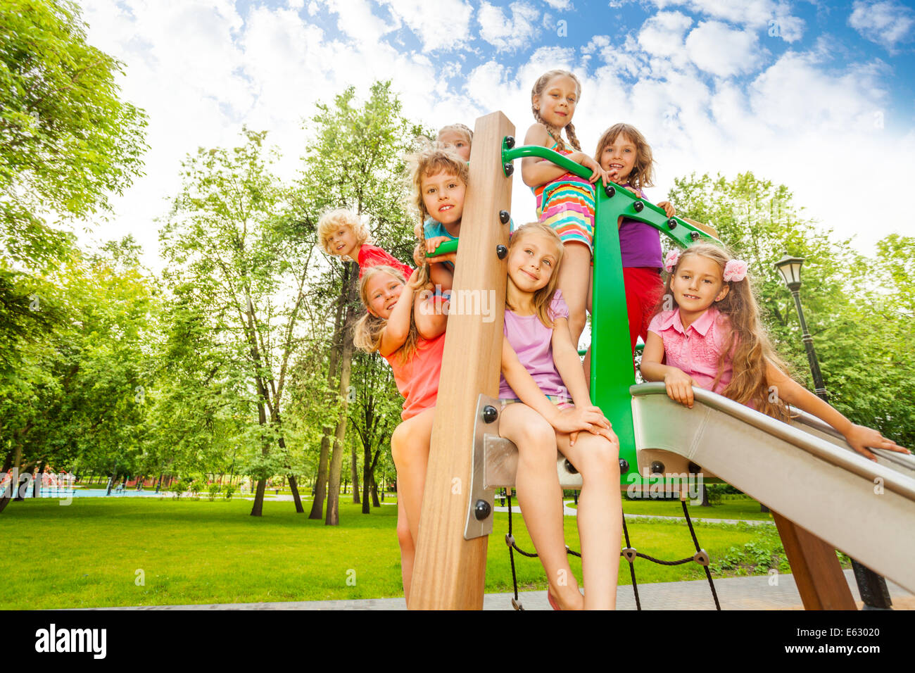 Happy Kids On Playground Chute In The Park Stock Photo Alamy