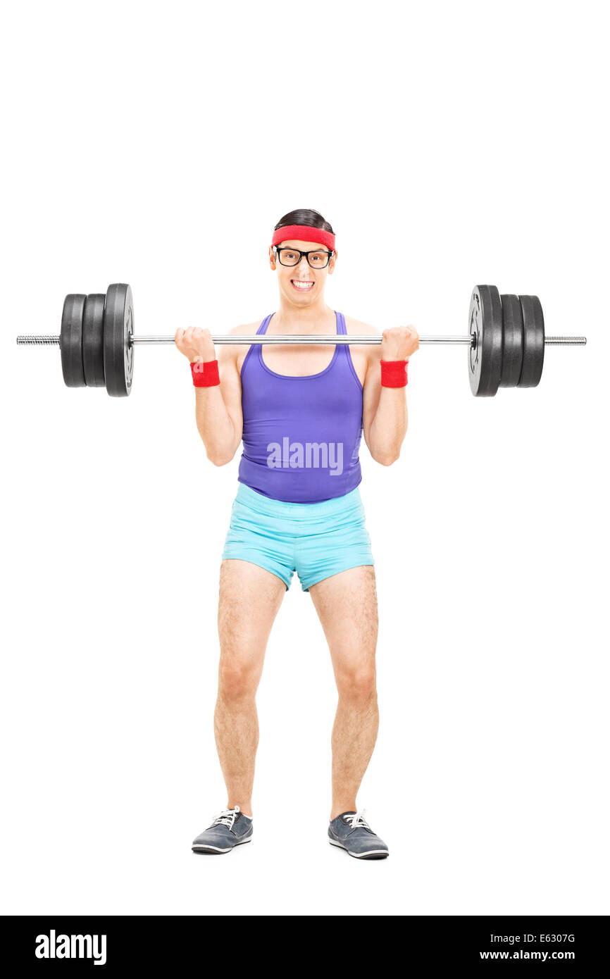 Full length portrait of a determined guy lifting a heavy barbell Stock Photo