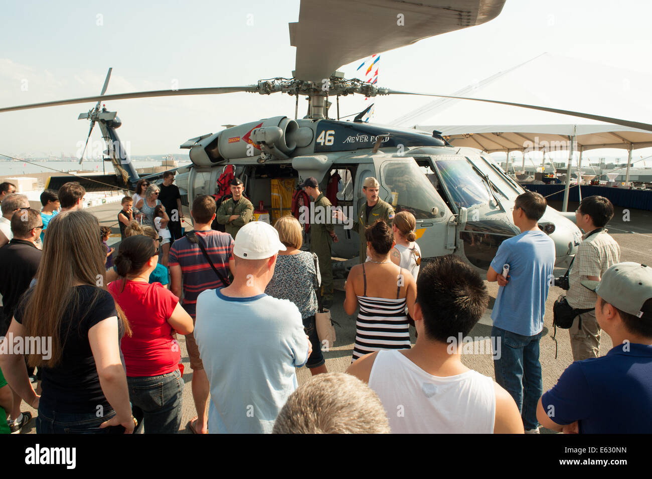 The crew of a Sikorsky SH-60 Seahawk answer questions from spectators. Stock Photo