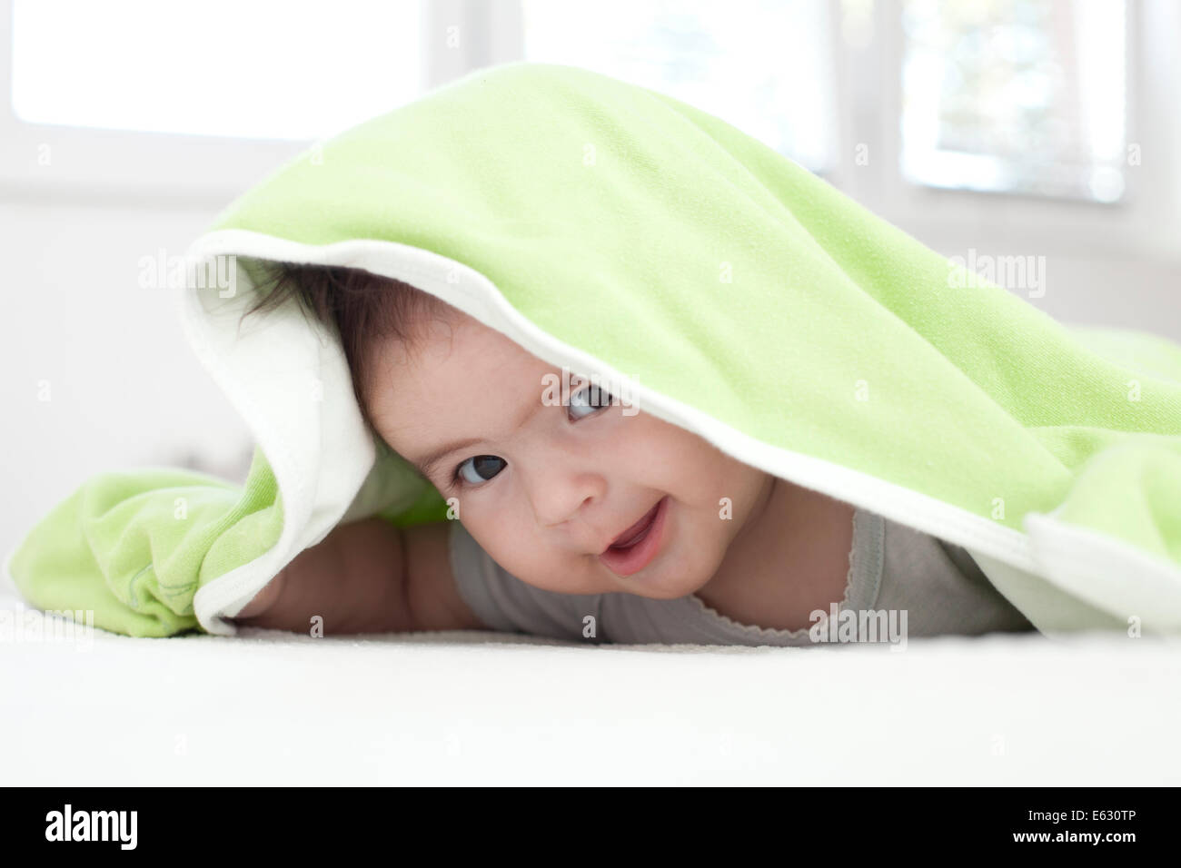Kid hiding under blanket hires stock photography and images Alamy