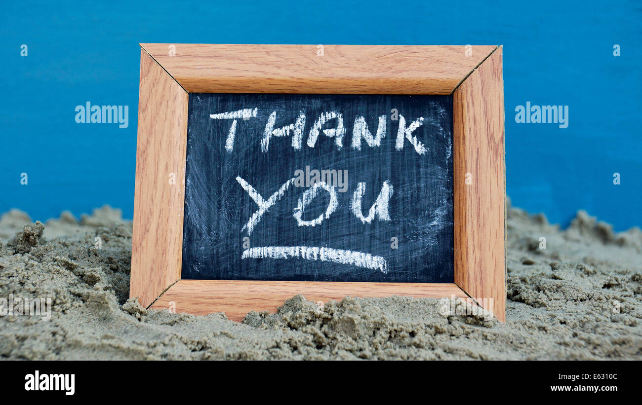 Thank you written on a chalkboard at the beach Stock Photo - Alamy