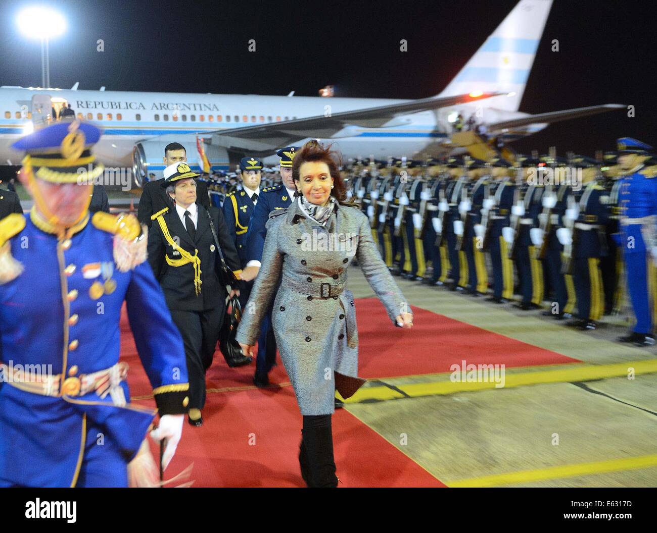 Asuncion, Paraguay. 12th Aug, 2014. Argentine President Cristina Fernandez (C) arrives at Silvio Pattirossi International Airport, in Asuncion, Paraguay, on Aug. 12, 2014. Fernandez is on a two-day official visit. Credit:  Presidency/TELAM/Xinhua/Alamy Live News Stock Photo