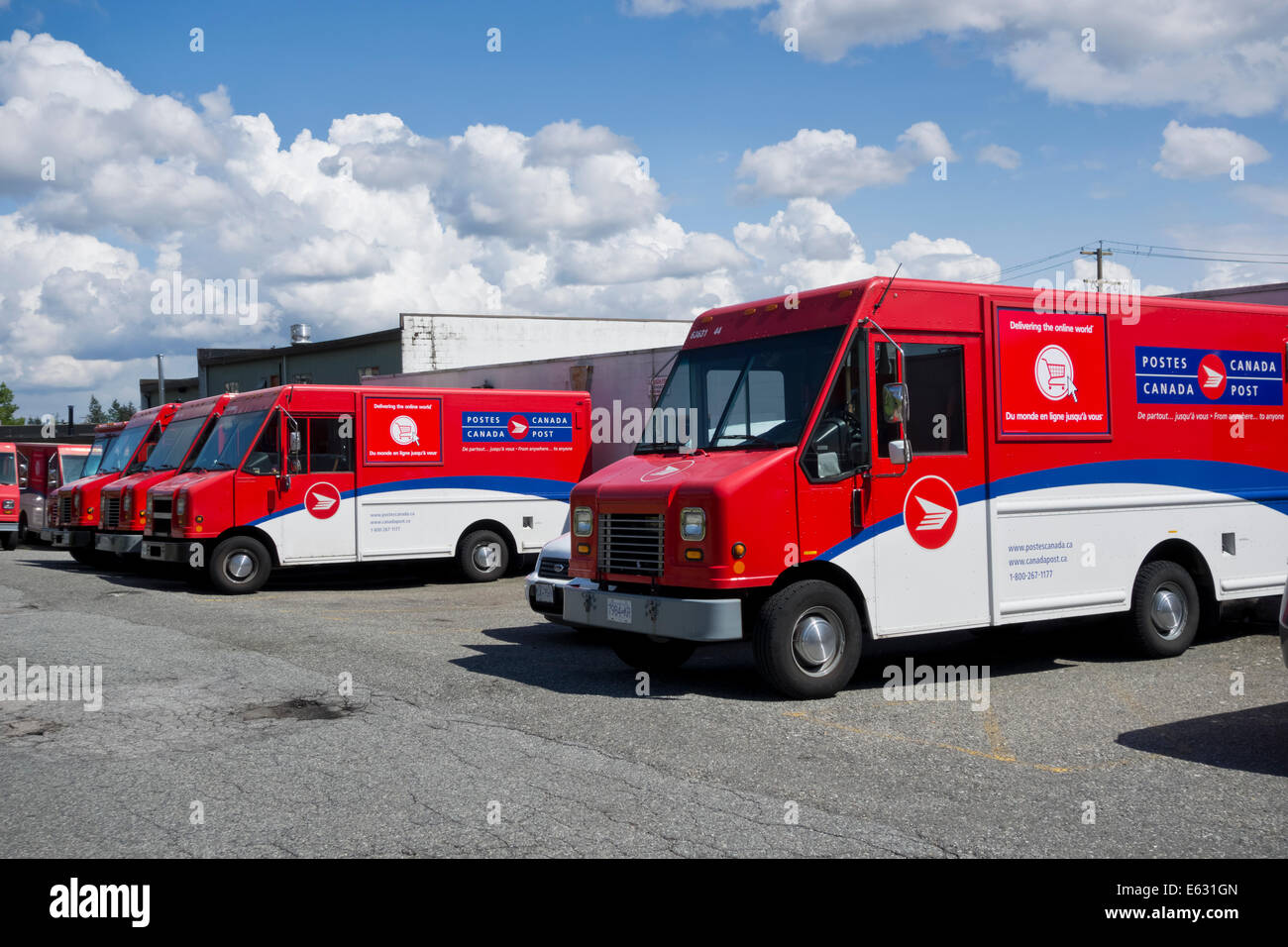 Canada Post mail delivery trucks parked behind the post office in Coquitlam, British Columbia, Canada (Greater Vancouver) Stock Photo