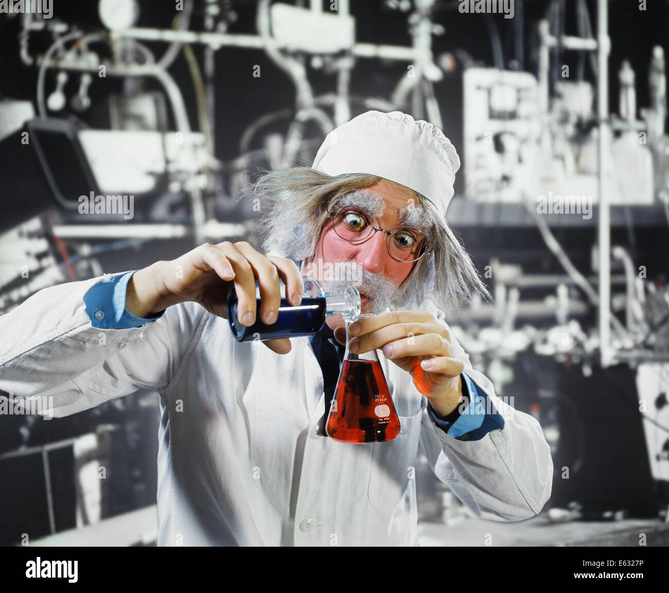 1970s MAN CRAZY LOONY MAD SCIENTIST CHEMIST IN LABORATORY POURING