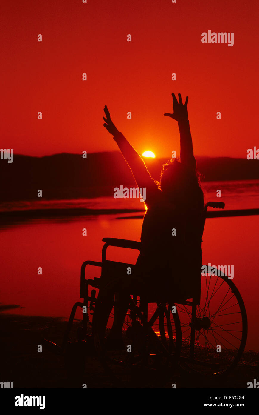 1980s SUNSET SUNRISE SILHOUETTE TEENAGE YOUNG WOMAN IN A WHEELCHAIR ...