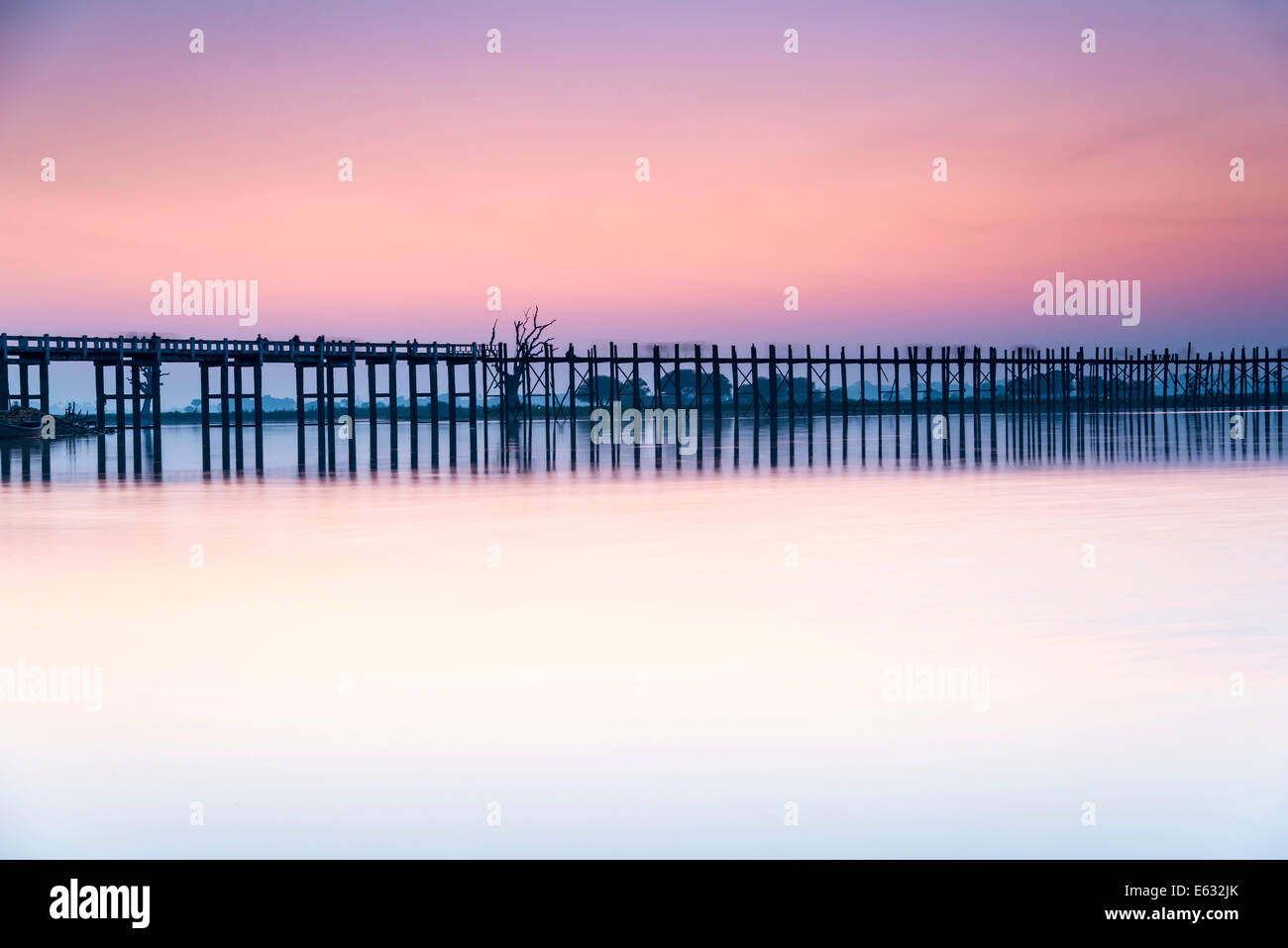 Teak bridge in the evening light, U Bein bridge across Thaungthaman ...