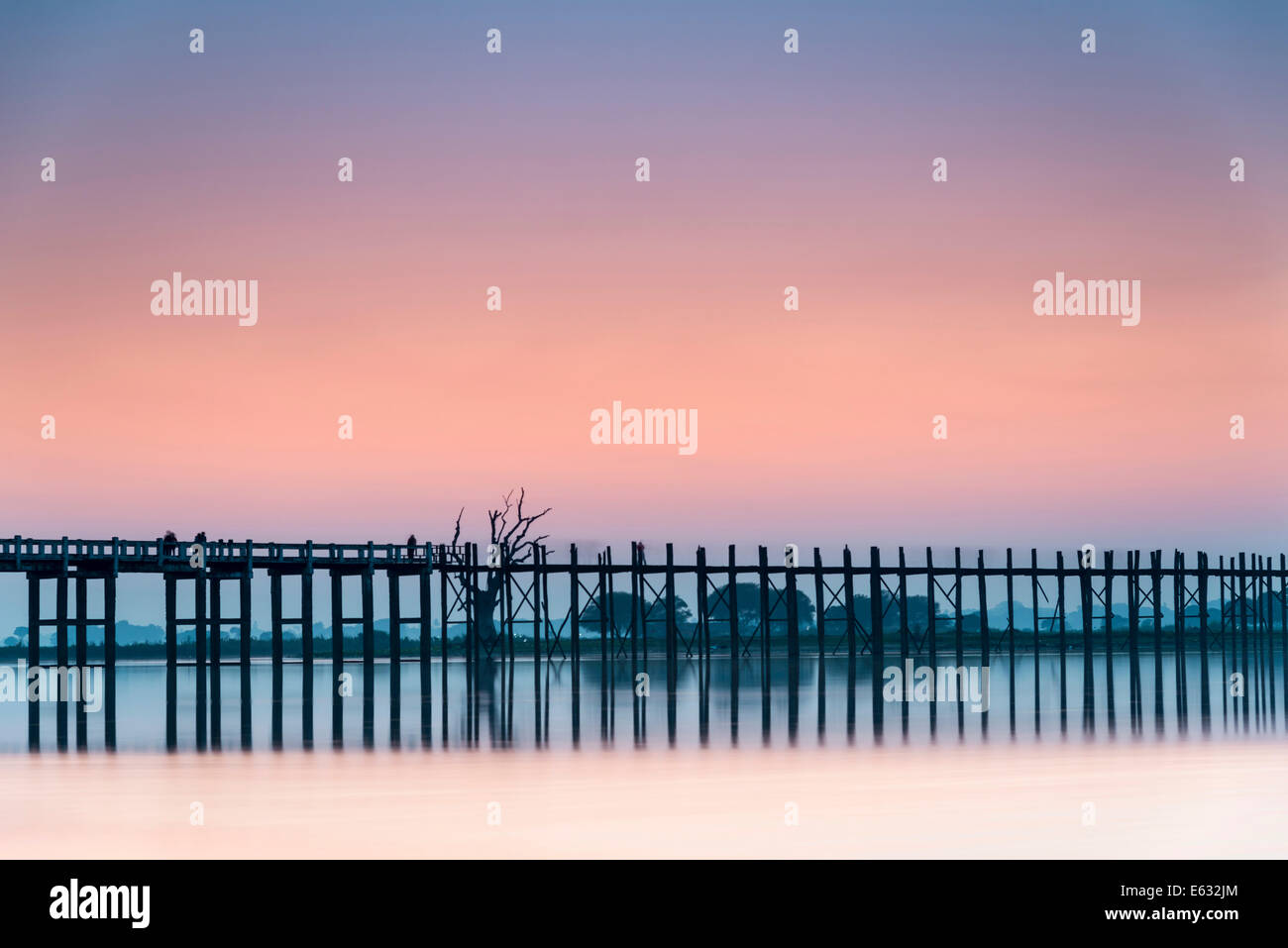 Teak bridge in the evening light, U Bein bridge across Thaungthaman ...