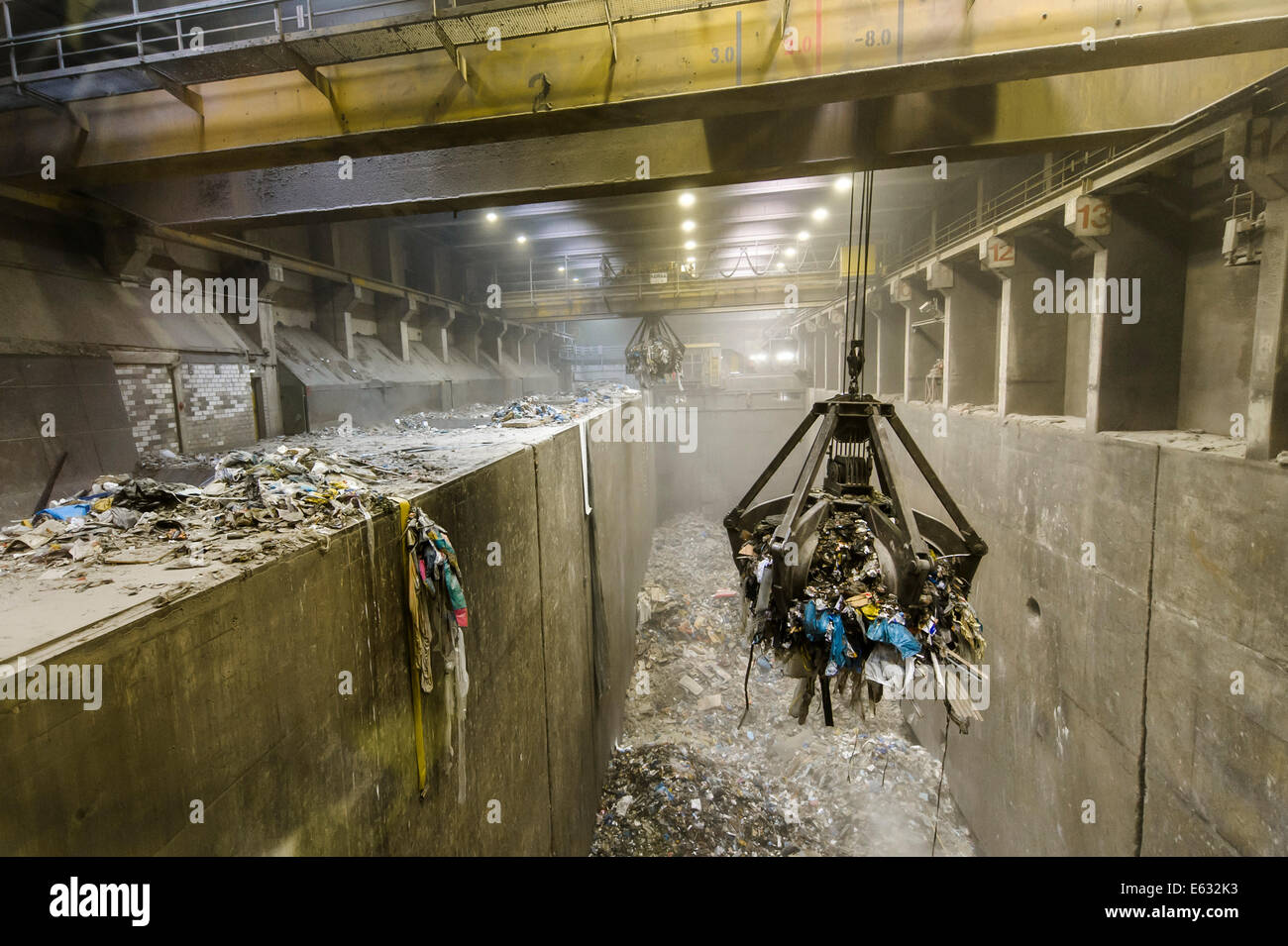 Crane transporting waste to the incinerators at a waste incineration