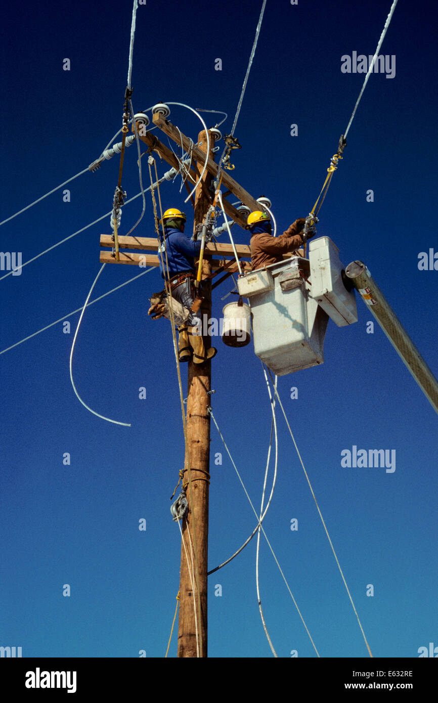 TWO TELEPHONE LINEMEN WORKING ON OVERHEAD WIRES Stock Photo Alamy