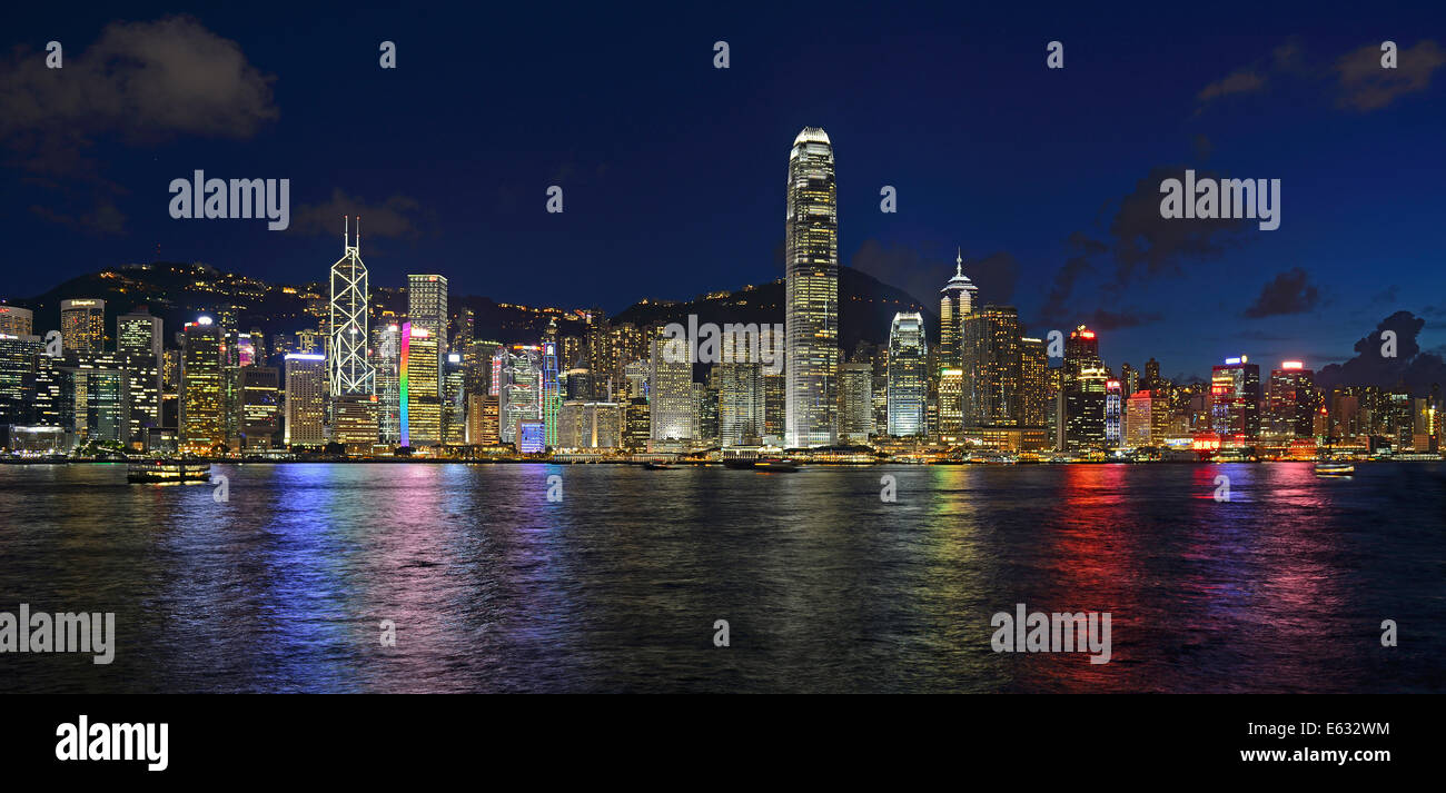 View at the blue hour from Kowloon on Hong Kong Island's skyline on Hong Kong River, Central, with Bank of China on the far left Stock Photo