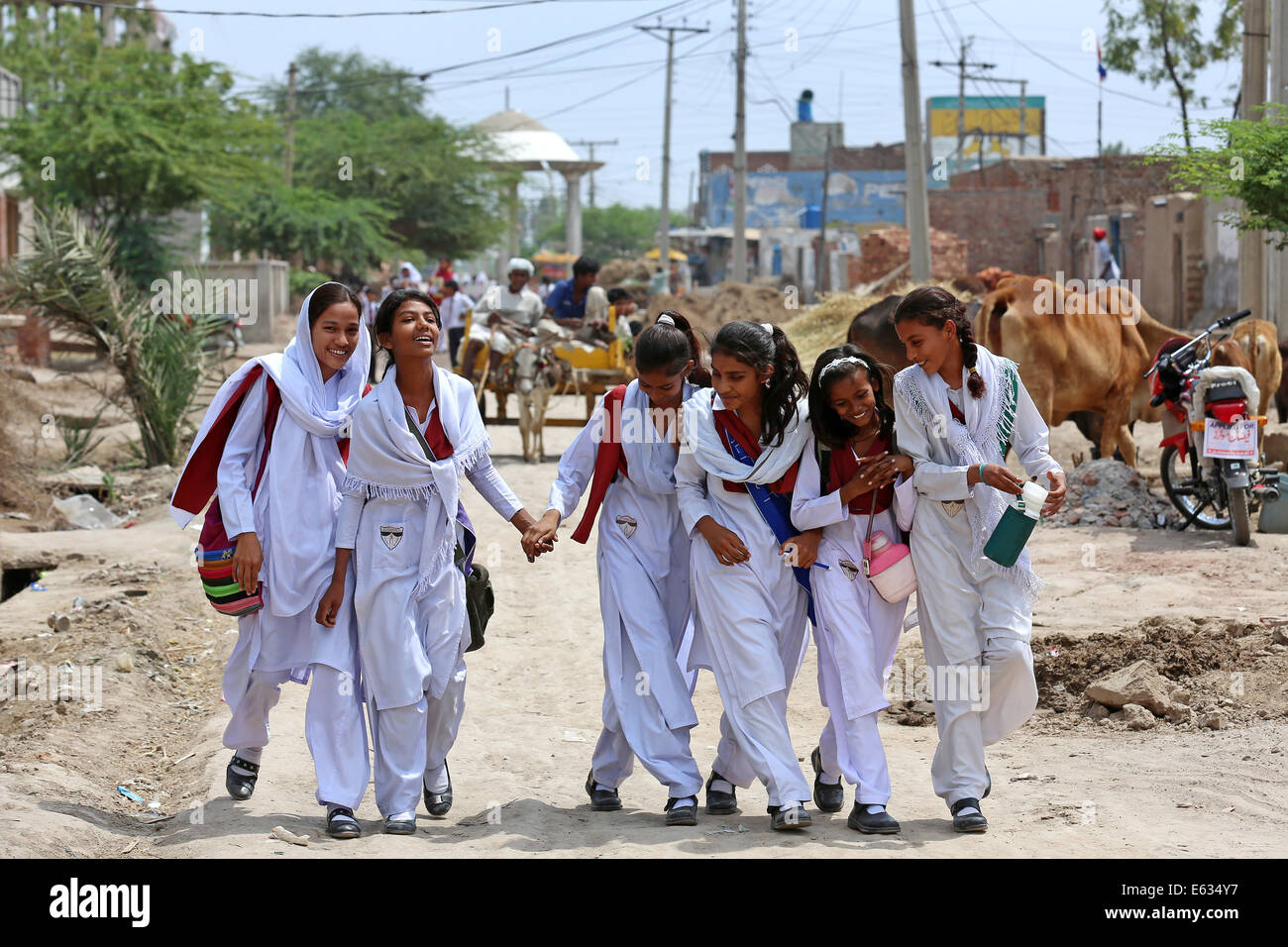 Young students pupils in school uniforms on their way home from school, christian village of Khushpur, Punjab Province, Pakistan Stock Photo
