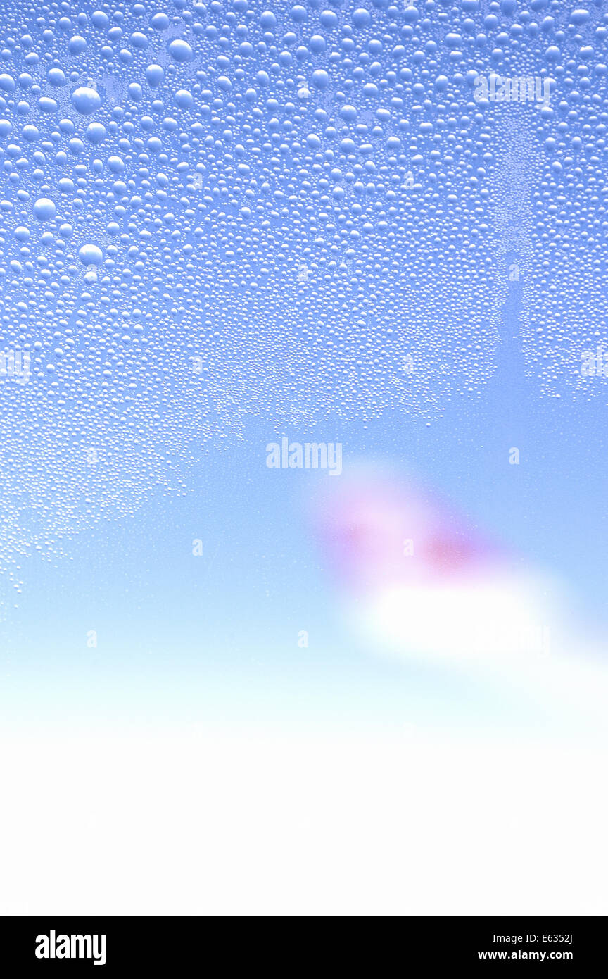 condensed water droplets on window surface on aircraft Stock Photo