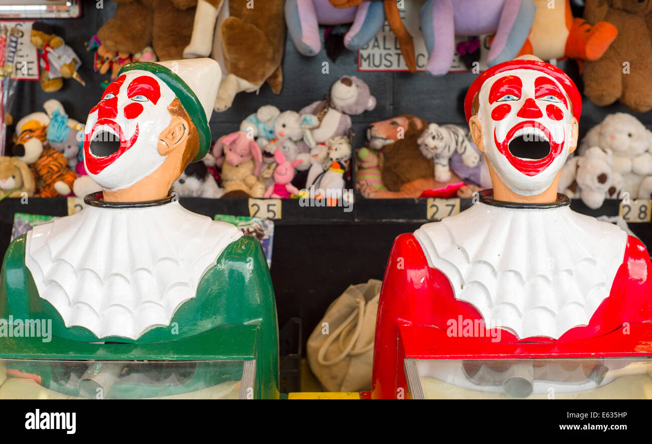 Game of Clowns at an amusement stall flip a ball in the mouth win a