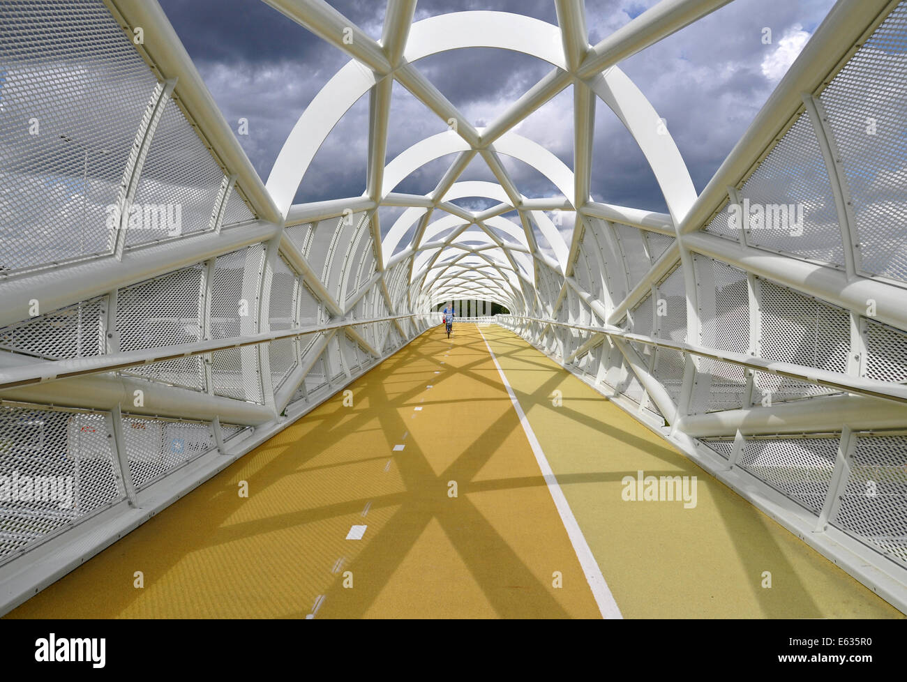 Cycle- and footbridge crossing the A15 motorway between Rotterdam and a recreation area, Netherlands Stock Photo